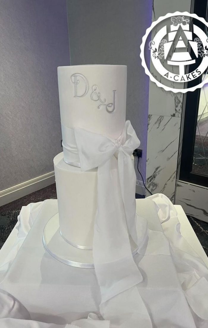 Two tier wedding cake with ribbon Two tier wedding cake with ribbon