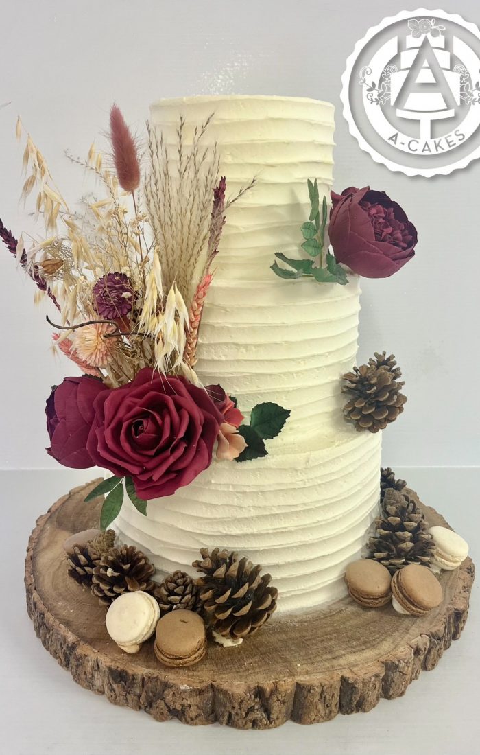 Three tier wedding cake with red roses Three tier wedding cake with red roses